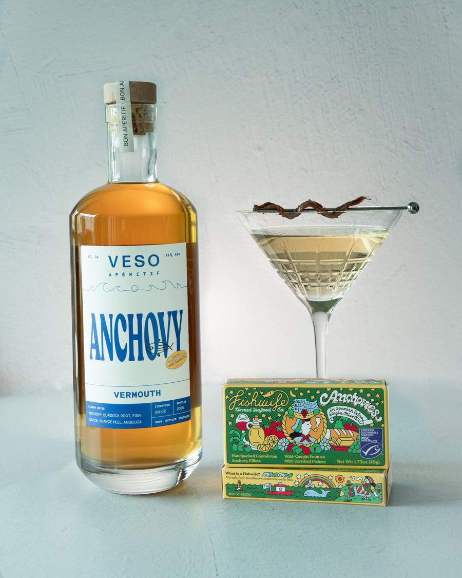 Veso Anchovy Vermouth bottle with a cocktail and box on a light background
